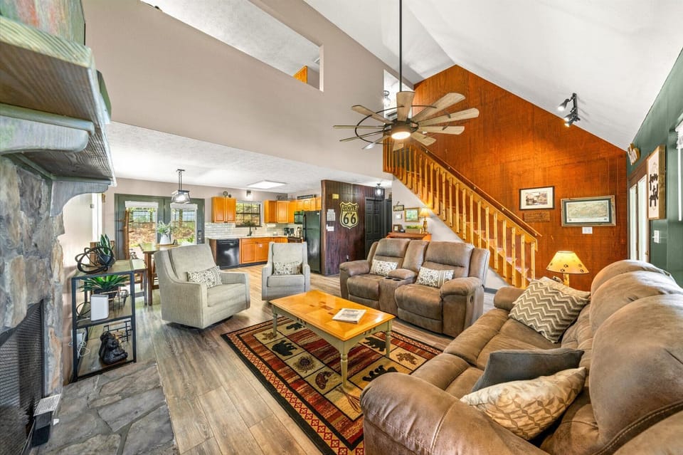 Living Room with vaulted ceilings, 70" TV, and gas fireplace and a view