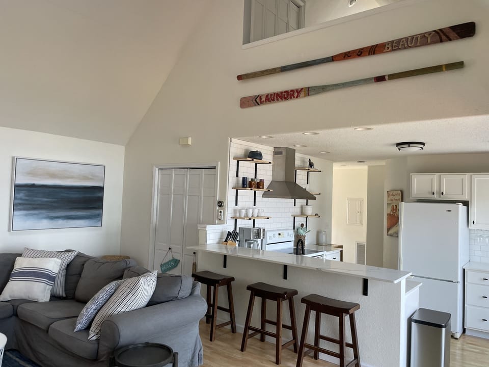 Living room, kitchen, lofted bedroom upstairs.