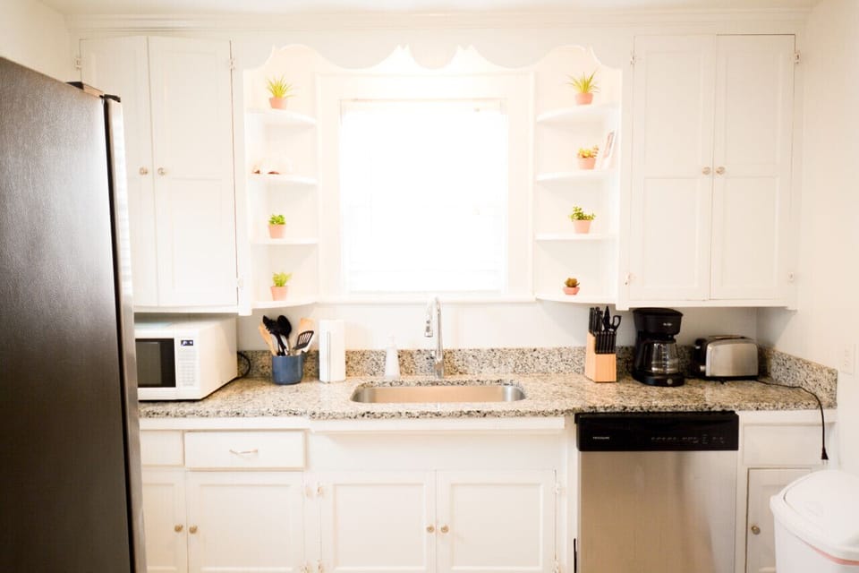 Ground floor kitchen with fridge and oven.