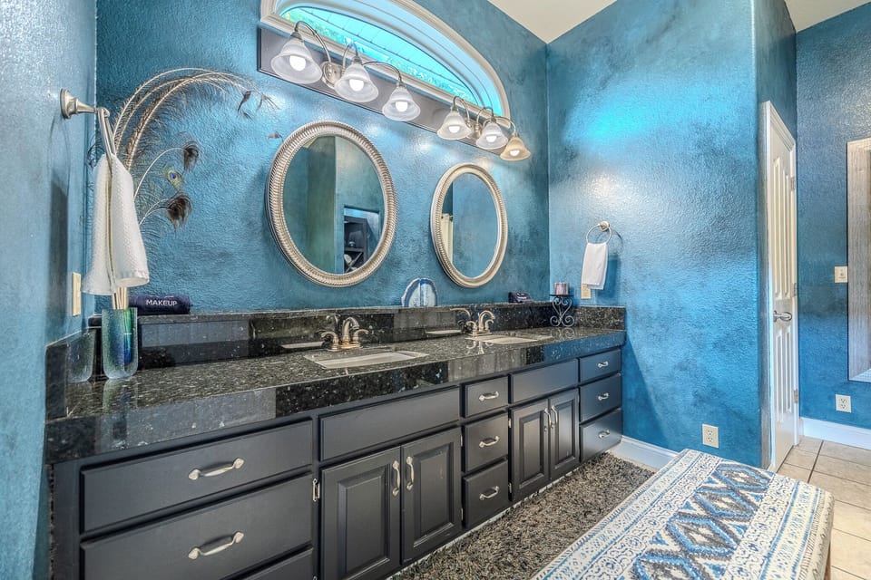 Grand Master Bath: Dual Sinks with Granite Countertops and Stylish Decor