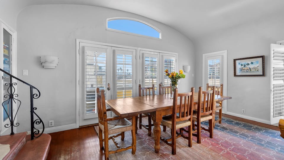 Great room, table seats 12 people. BBQ located outside of French doors.