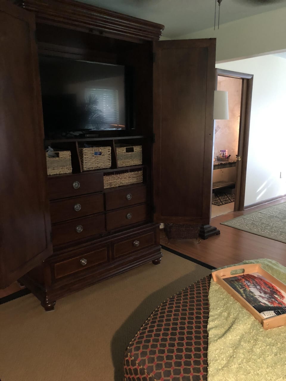 TV in sitting room armoire.