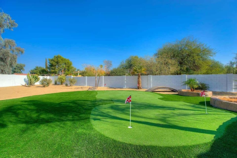Our home offers a putting green complete with putters and golf balls.