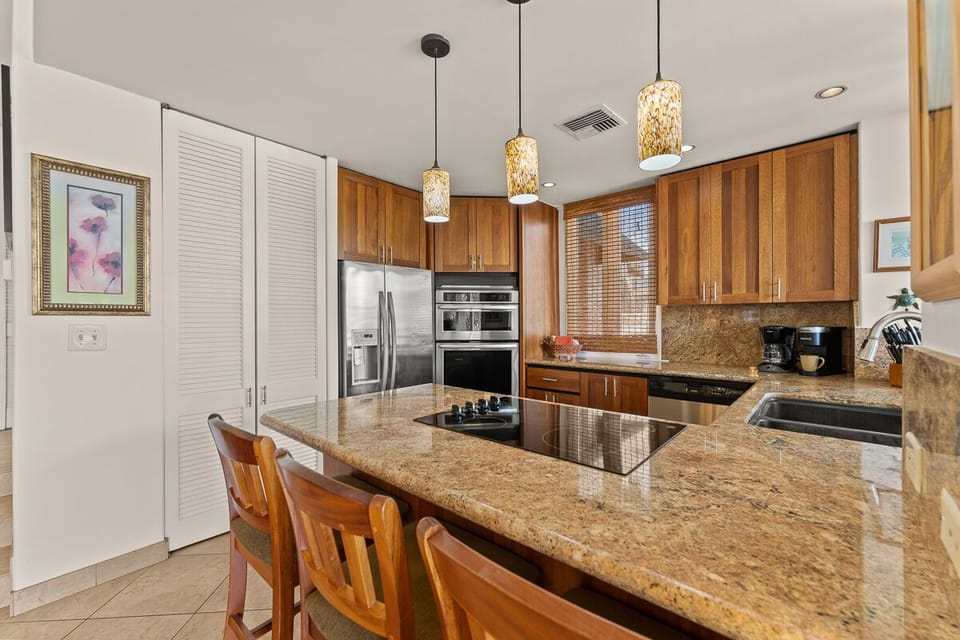 Note the large pantry to the left and bars stools