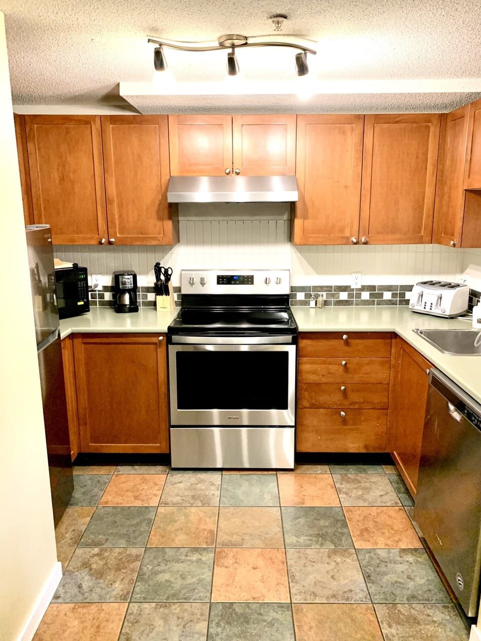 Full Kitchen With Stainless Steel Appliances 