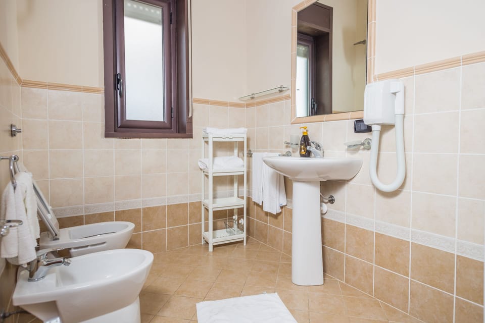 Triple Room, Sea View | Bathroom | Shower, free toiletries, hair dryer, bathrobes