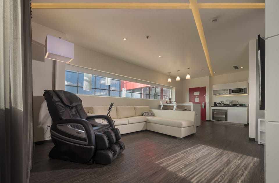 Suite, 1 King Bed, Non Smoking | In-room safe, laptop workspace, iron/ironing board