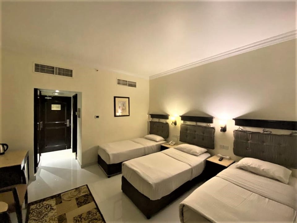Triple Room, Pool Access | Egyptian cotton sheets, premium bedding, minibar, in-room safe
