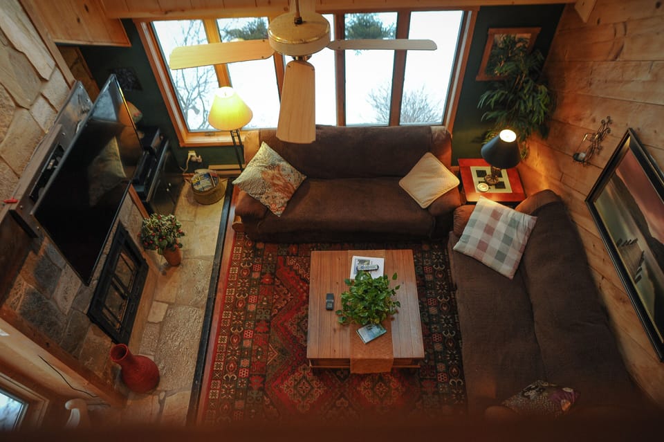 Great Room with 3 large couches, 54' TV, propane fireplace and more! 