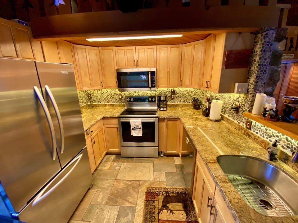 New kitchen.  All stainless appliances.  Custom lighting.  Well stocked!