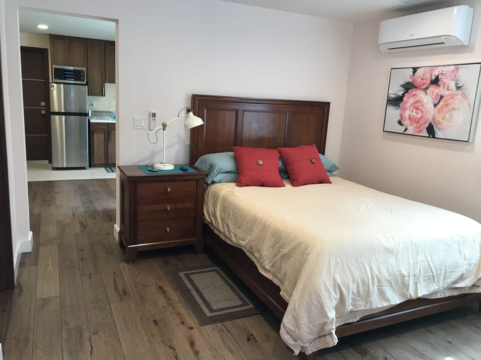 Master bedroom has queen size Luxury mattress, AC, and night stand 