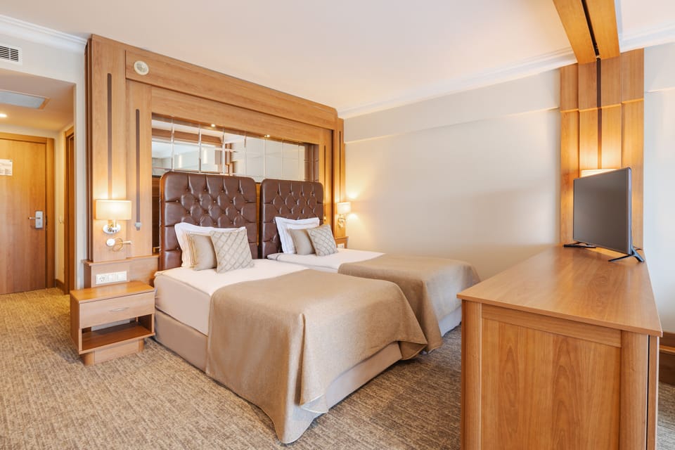Senior Triple Room, Golf View | Free minibar items, in-room safe, free WiFi