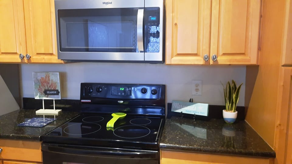 Kitchen with brand new microwave. 