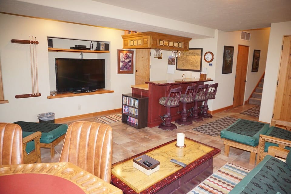 Lower Level Bar/Entertainment Area With Queen and Two Single Futons