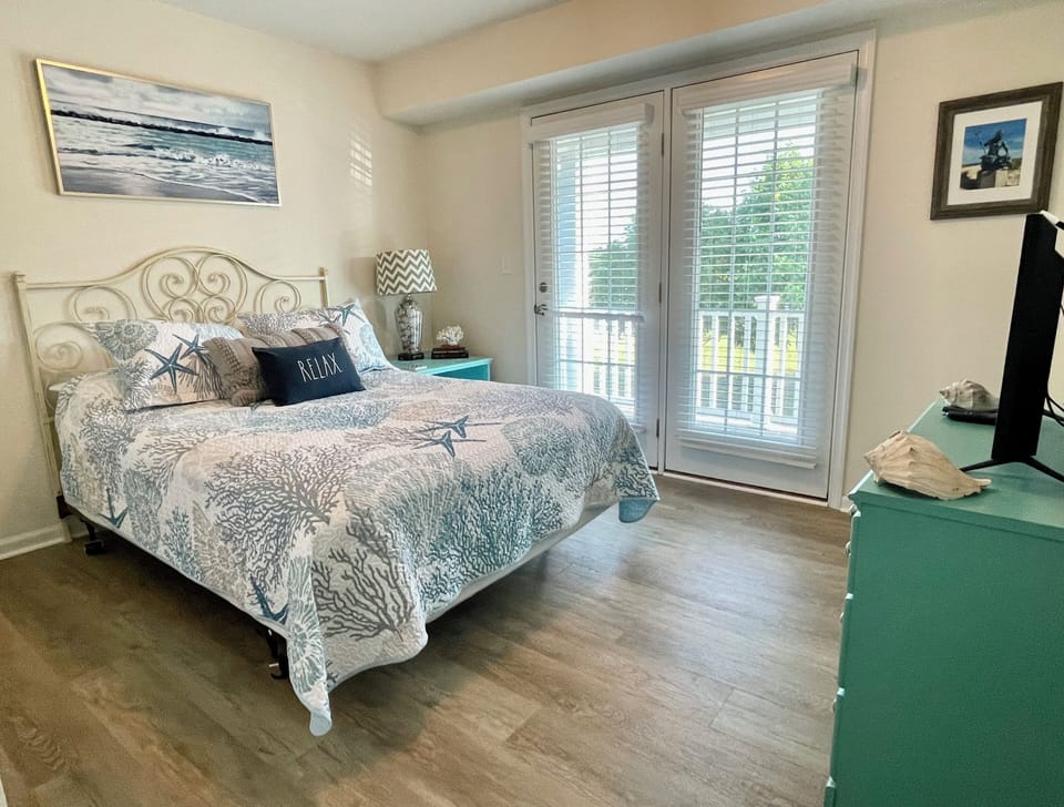 Guest Room - Queen Bed, Smart TV & Balcony to upper level porch. 