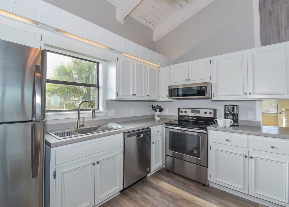 Kitchen with white cabinets and stainless steel appliances