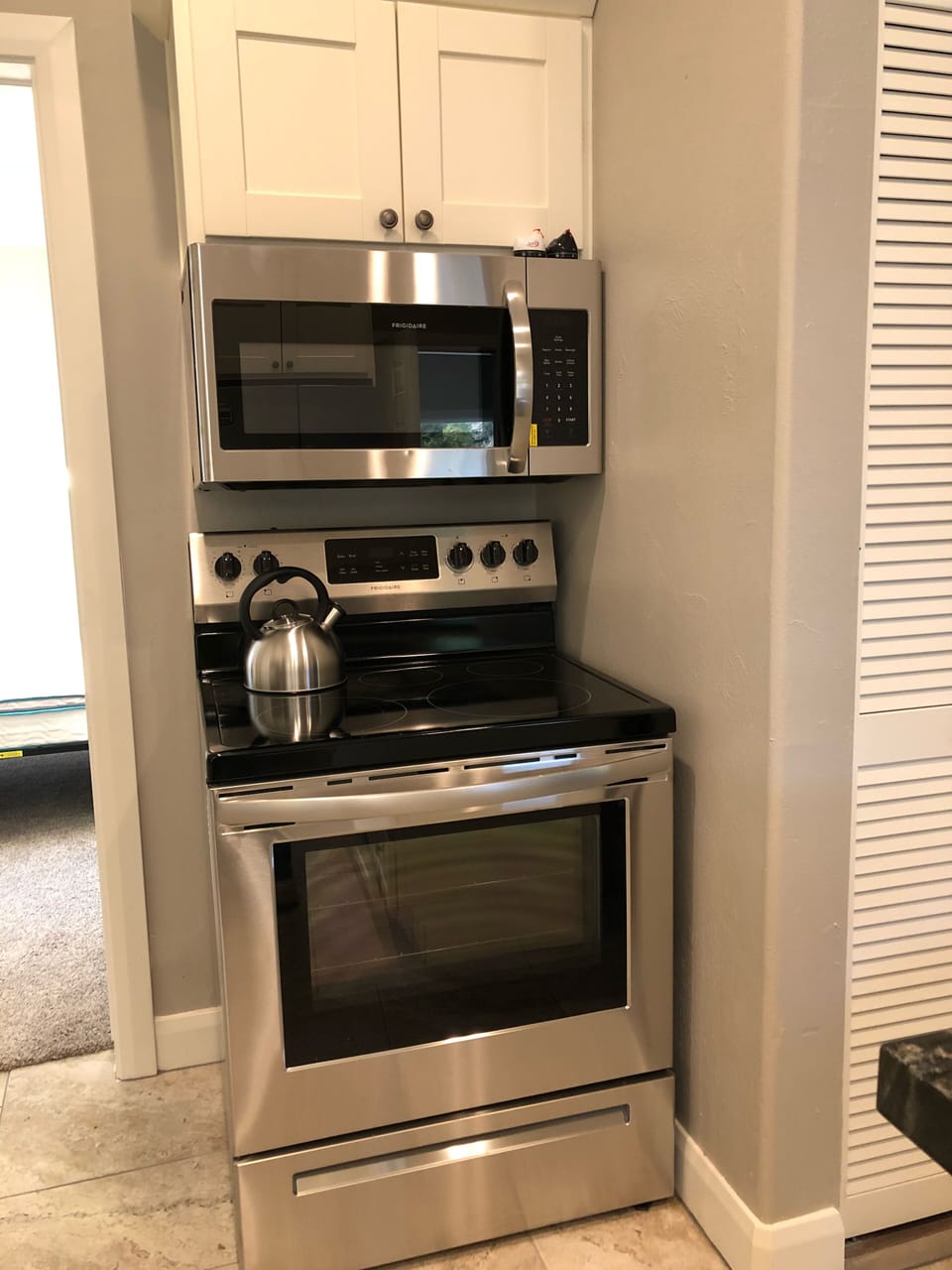 New stainless appliances are in the kitchen.
