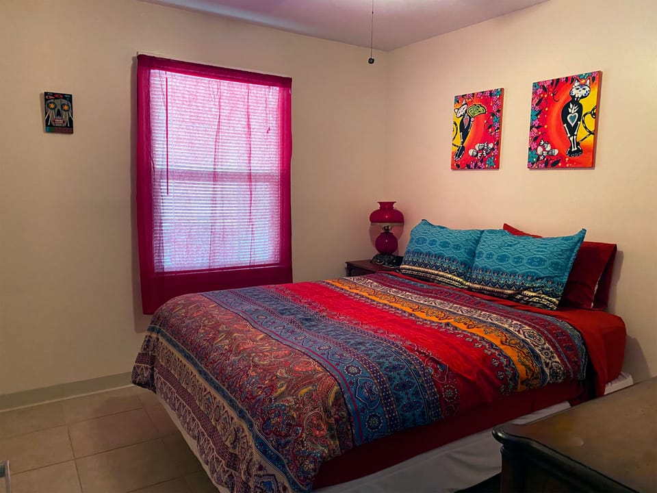 Cozy master bedroom with queen size bed and a closet.