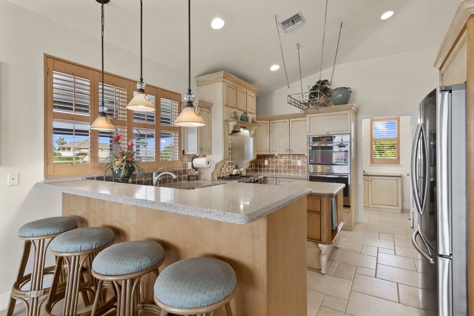 View of kitchen and door to laundry/pantry.