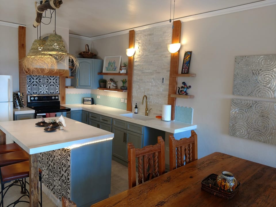 Our remodeled kitchen has everyhing you should need to cook at home if you would like to stay in and dine out on the balcony overlooking the Sea of Cortez. We also have a large island with seating.