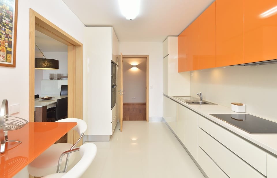 Fully equipped kitchen and laundry room.