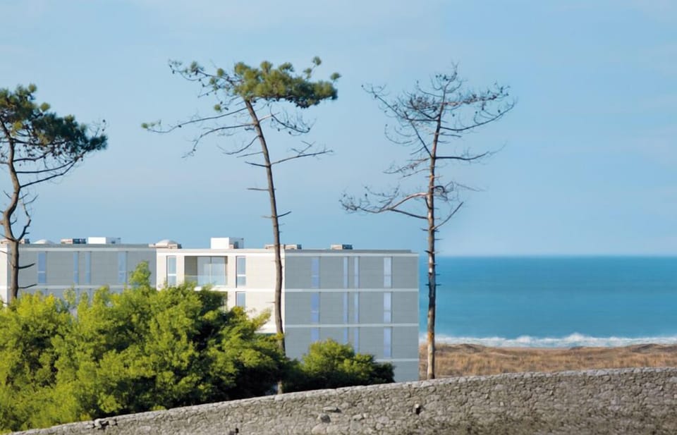 Closed condo with pool, facing the beach and countryside. 