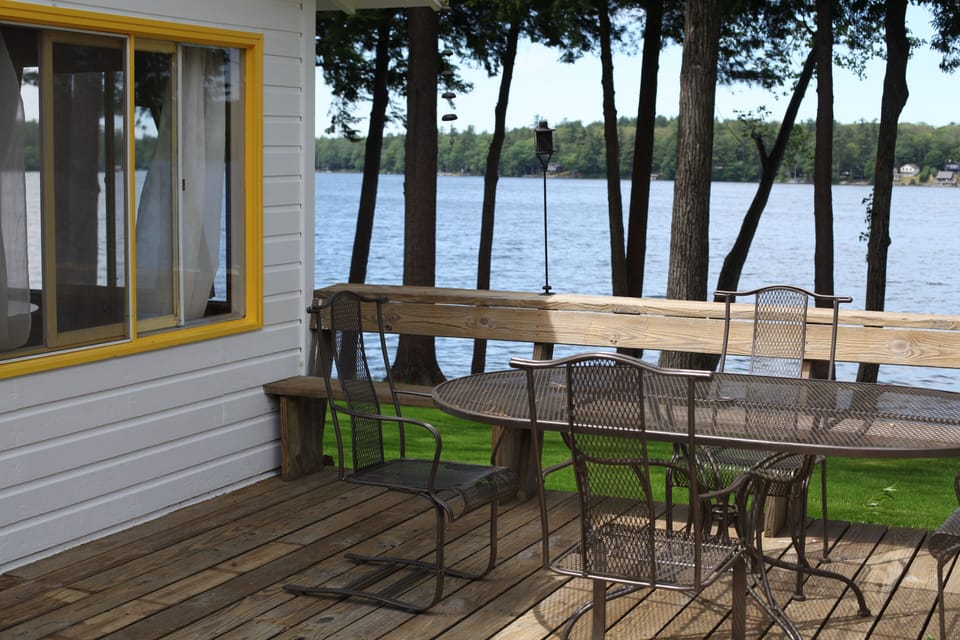 Cottage porch off of livingroom with view of lake