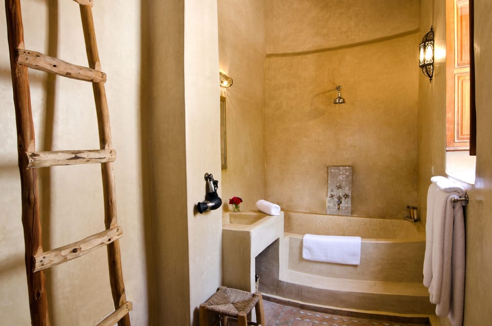 Double Room (Douria Suite) | Bathroom | Shower, rainfall showerhead, hair dryer, slippers