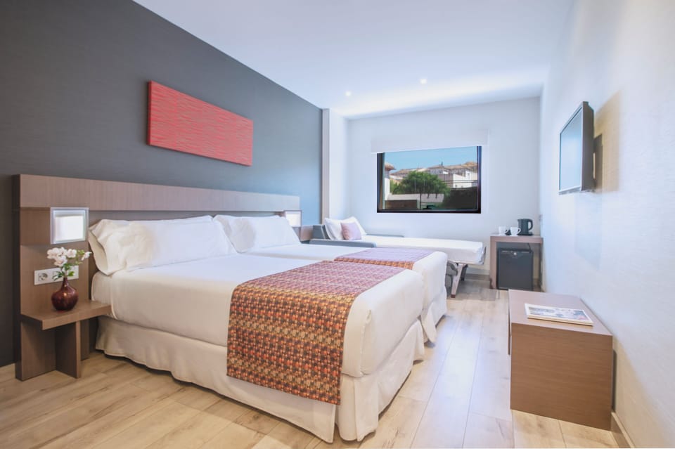 Triple Room | In-room safe, desk, laptop workspace, blackout drapes