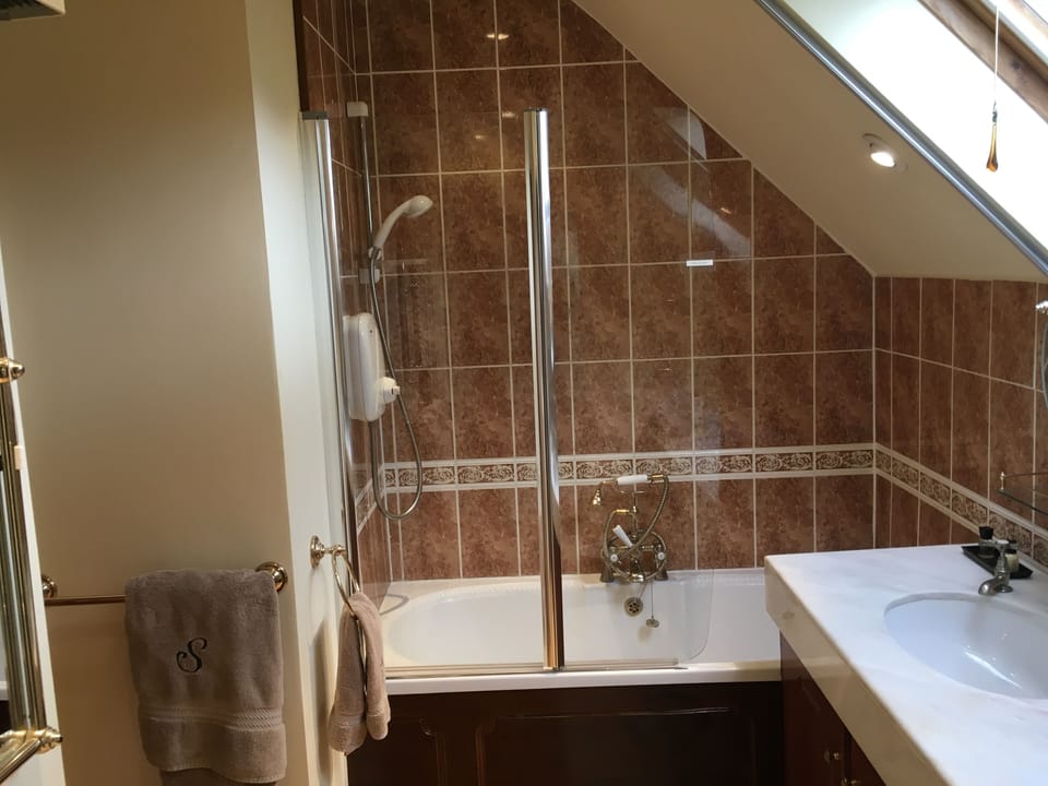 Master tub/shower, separate toilet room, solid Ruchita marble sinks, hair dryer