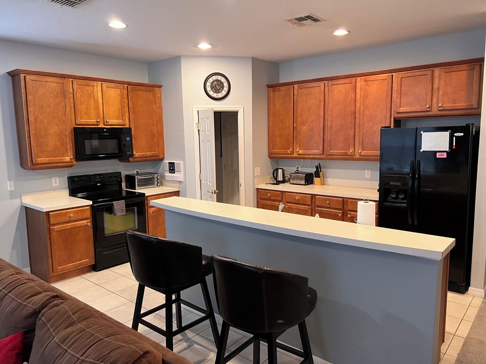Open plan Kitchen with Breakfast bar, Music intercom system and walk in Pantry.