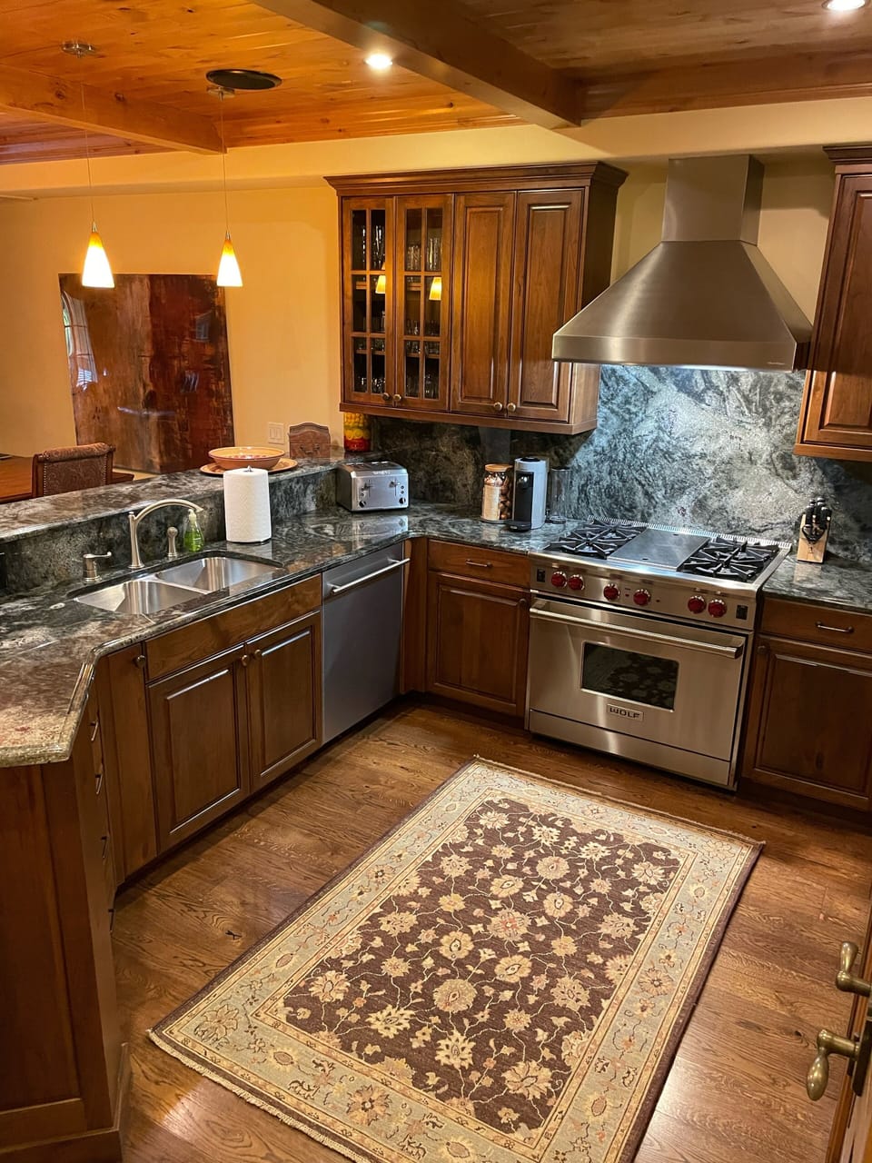 Gourmet kitchen with Wolf gas range and high end appliances