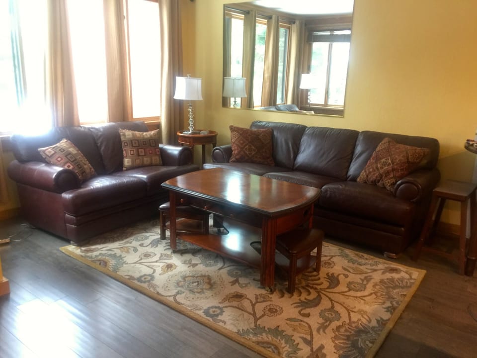 Living Room with Sofa Bed and Foosball Table