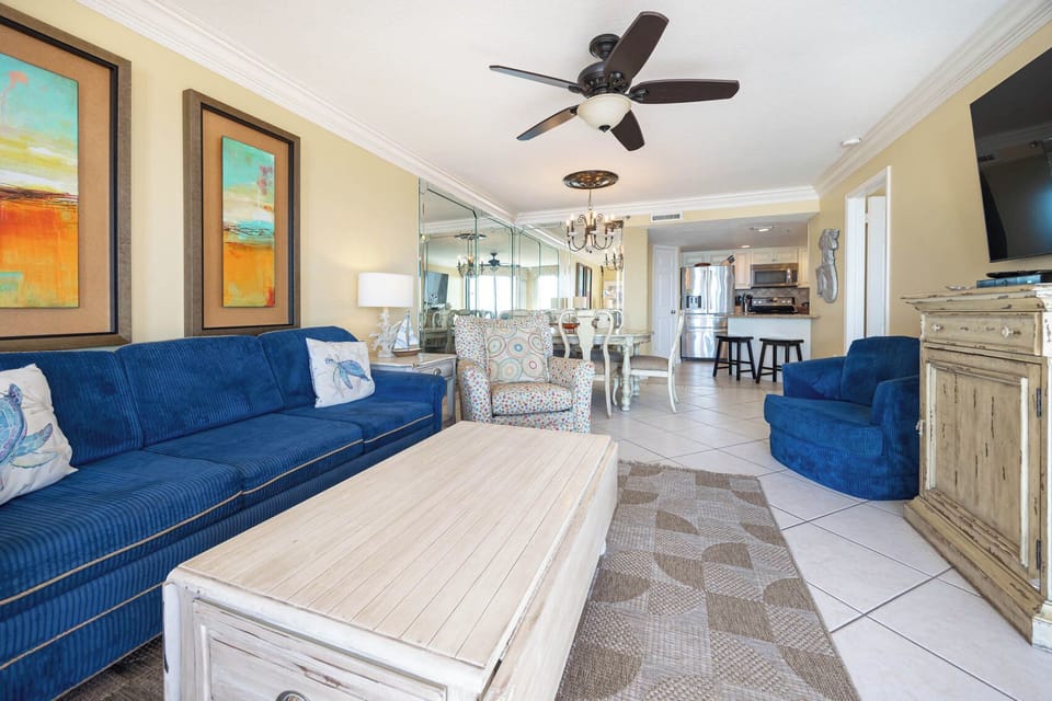 Relax in the vibrant living area with plush seating and a view that invites you to unwind and enjoy your stay