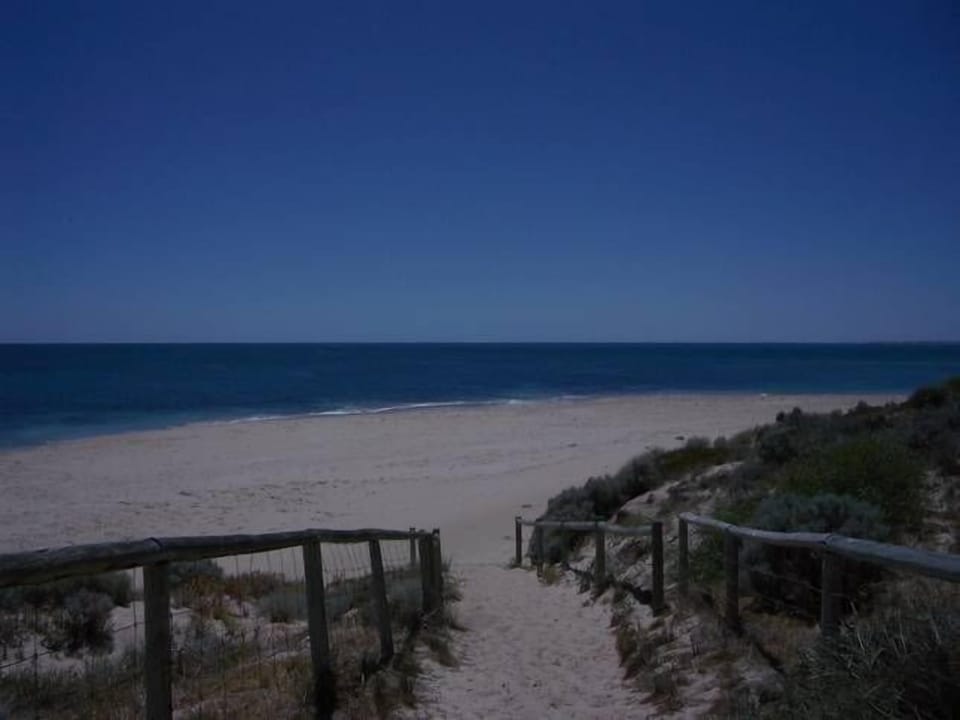 Beach access to the right looking North towards Blue Bay.