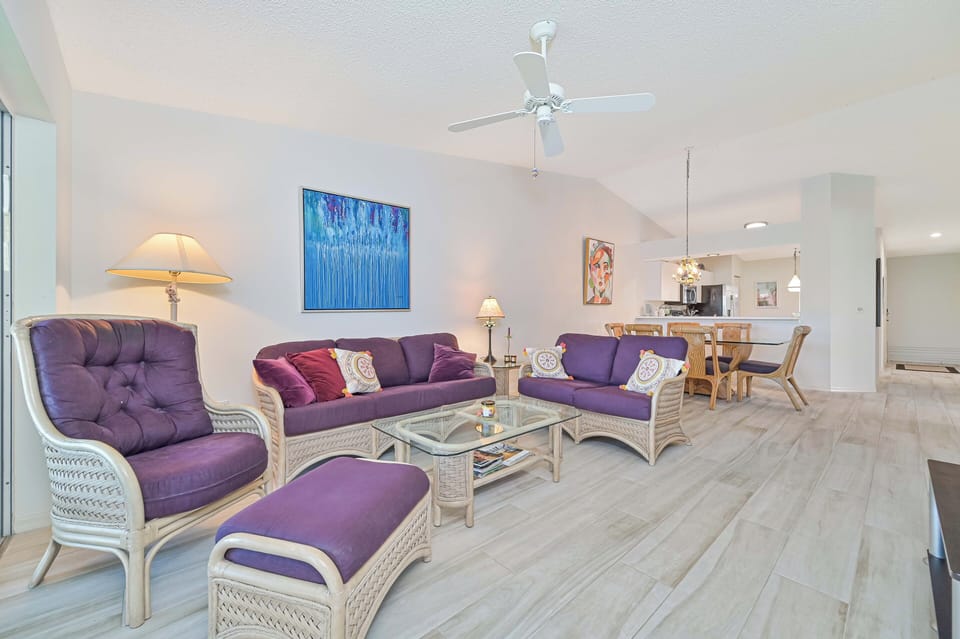 BEL201 - Comfortable seating area with flat screen TV. Sliding doors provide access to the screened in balcony