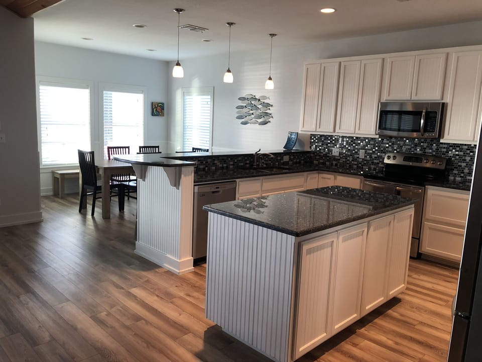 Kitchen and dining w Copano Bay views