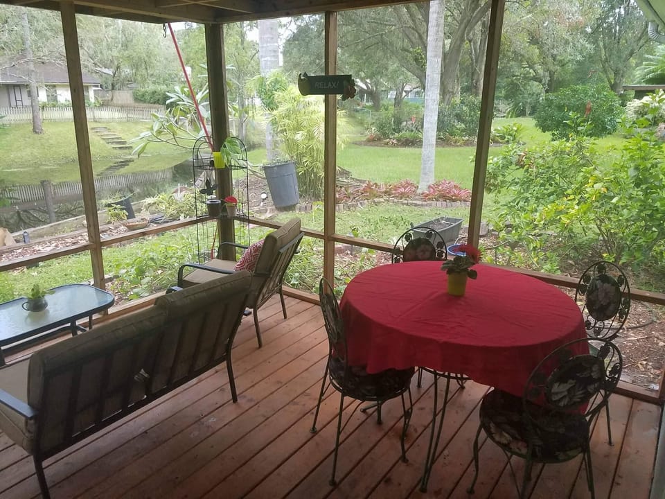 Table on the screened in patio seats 4