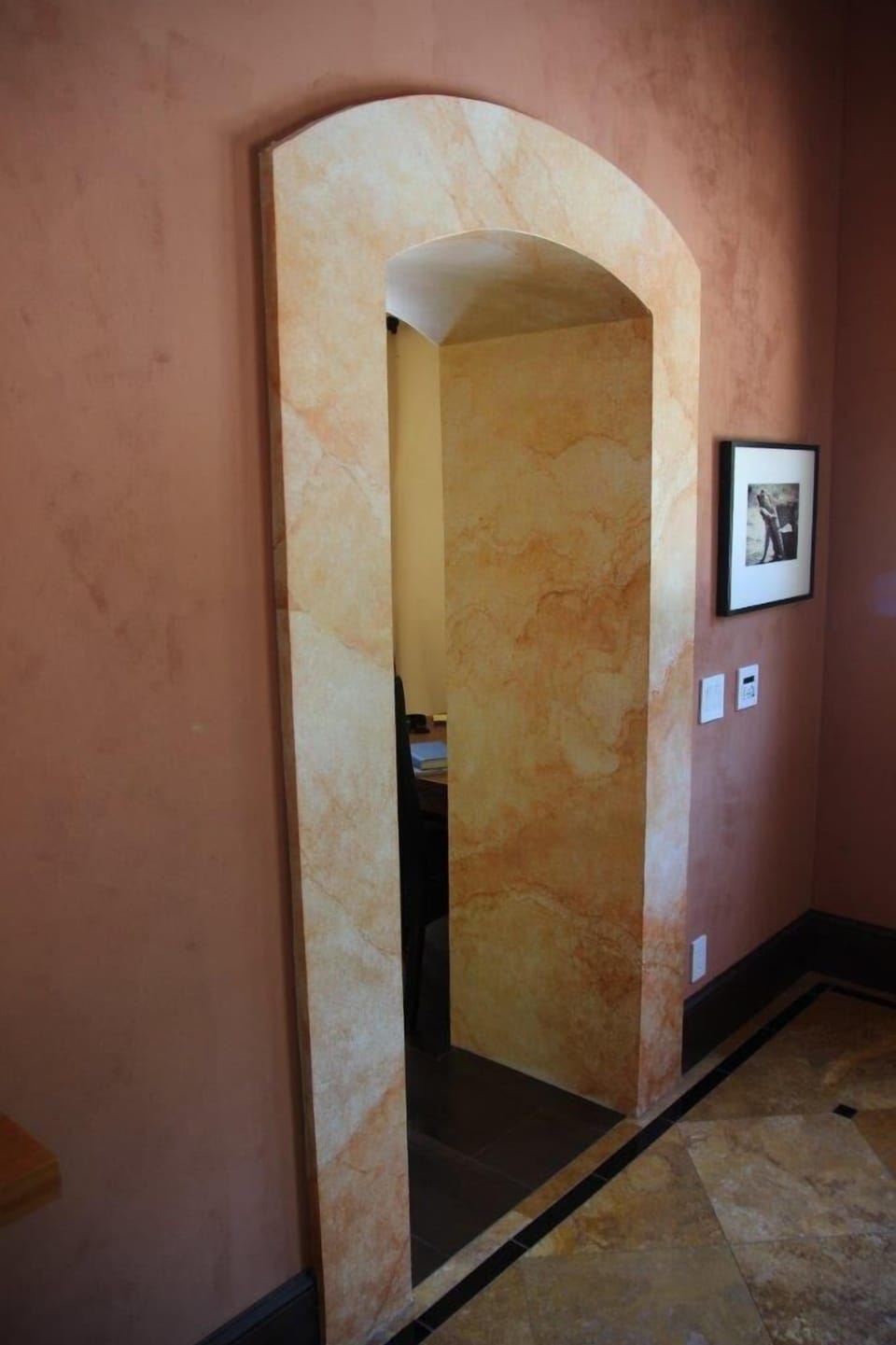Faux marble interior doorway from living room to kitchen