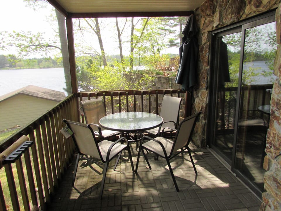 Relax inside the walkout level screen porch