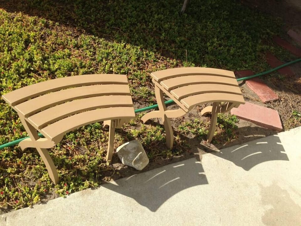 Benches in front of home for removal of shoes or putting them back on.