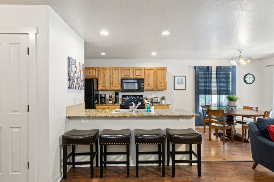 There's plenty of seating at the dining table and kitchen bar!