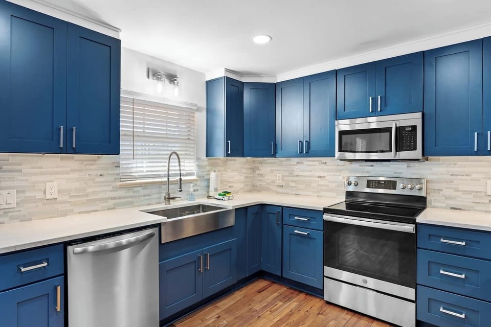 Large Beautiful Kitchen Recently Renovated with Beautiful Coastal Blue Cabinets, Quartz Countertop, Stainless Steel Appliances, Farm Sink and Tons Of Storage 