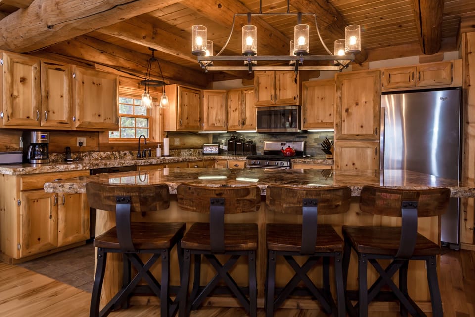 Chef's kitchen with bar area seating for 4 - great for conversation or breakfast