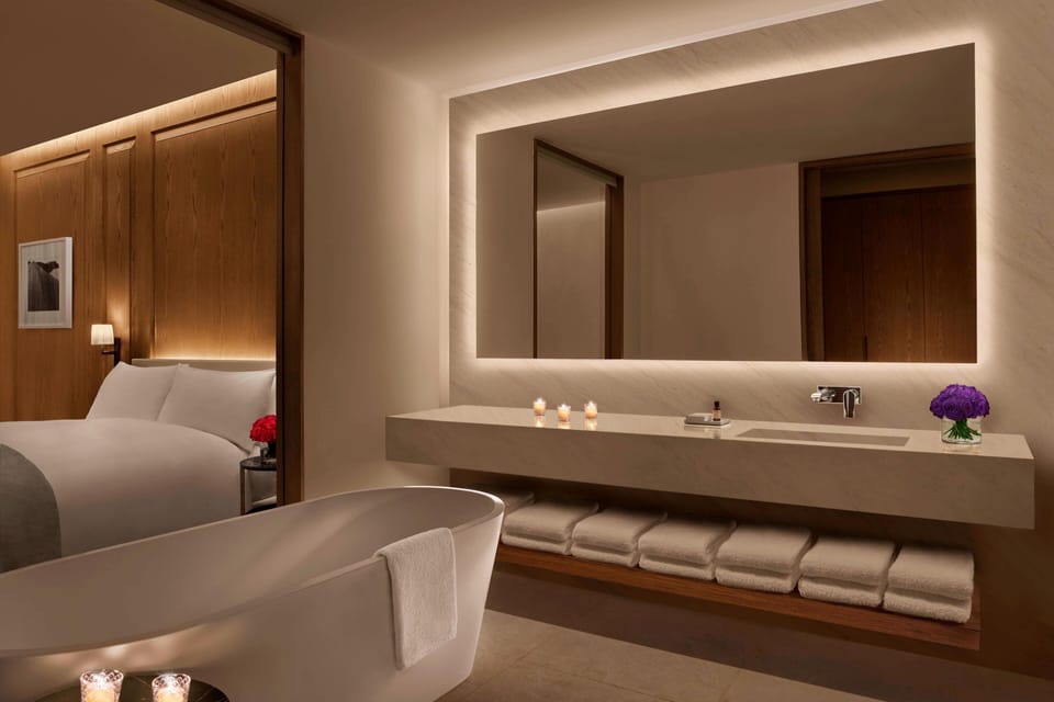 Separate tub and shower, designer toiletries, hair dryer, bathrobes