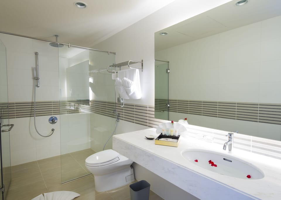 Eco-friendly toiletries, hair dryer, slippers, bidet