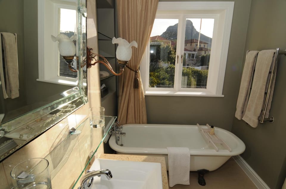 Rainfall showerhead, hair dryer, slippers, towels