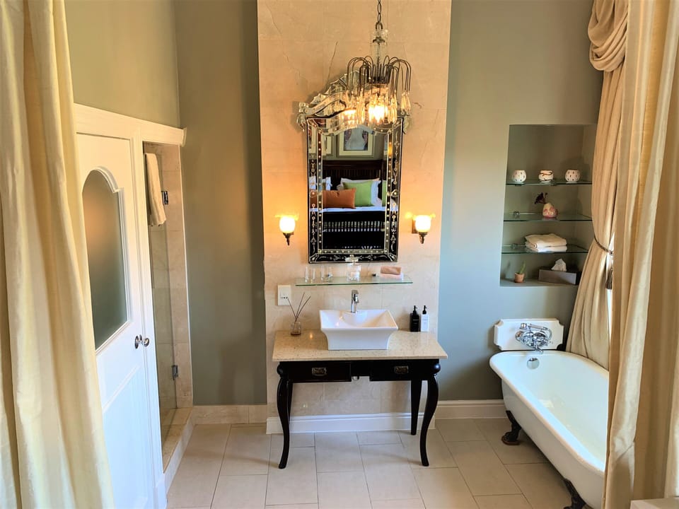Luxury Double Room | Bathroom | Rainfall showerhead, hair dryer, slippers, towels