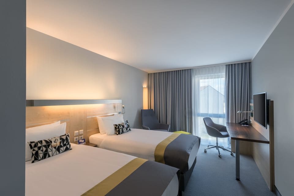Standard Room, 2 Twin Beds | 1 bedroom, hypo-allergenic bedding available, desk, laptop workspace