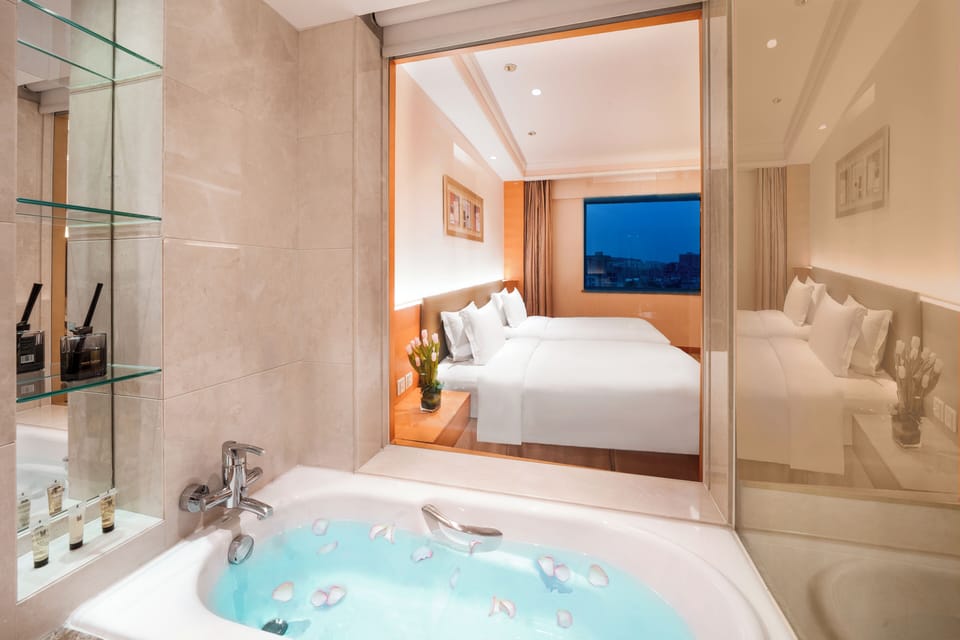Separate tub and shower, designer toiletries, hair dryer, bathrobes